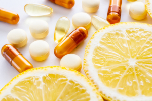 Close-up of colorful eye vitamins and lemon slices arranged on a table”