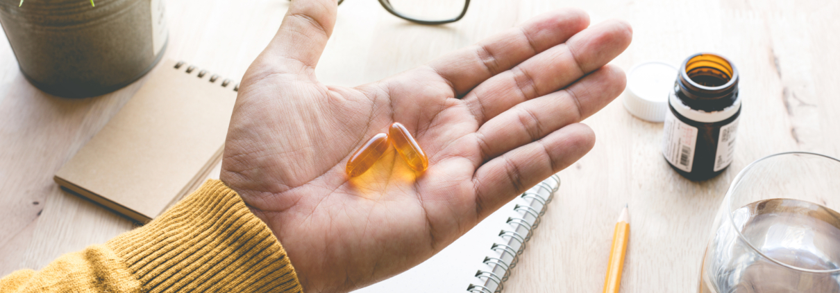 Close Up of a hand holding eye vitamins