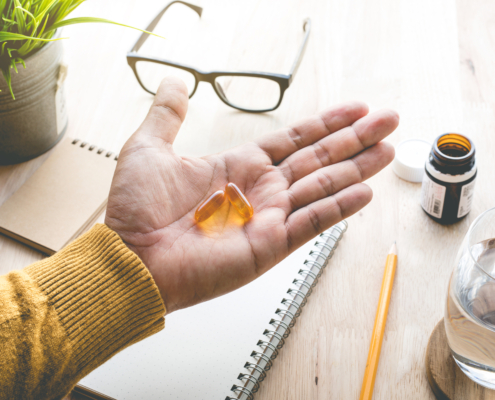 Close Up of a hand holding eye vitamins